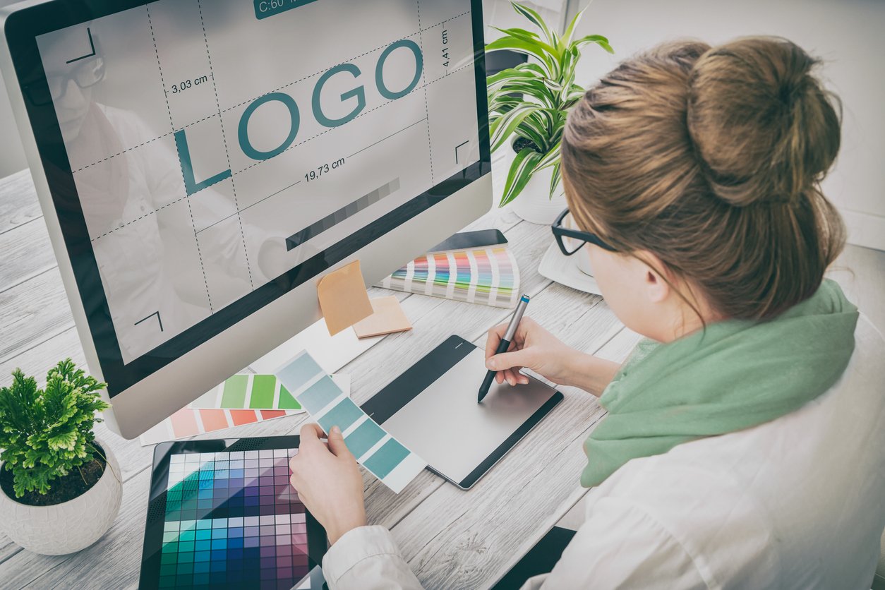 Graphic designer at work. Color samples. logo design brand designer sketch graphic drawing creative creativity draw studying work tablet concept - stock image